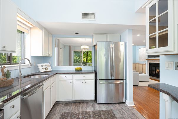 Fireplace, Interior, Kitchen, Pendant Lights, Recessed Lighting, Stainless Steel Appliances, Wood Texture Flooring