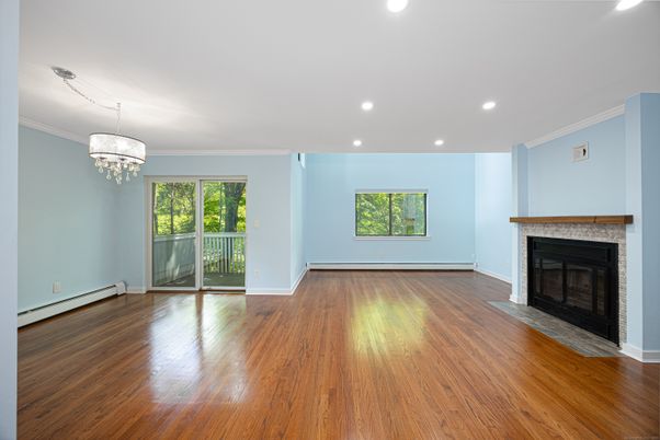 Chandelier, Empty room, Fireplace, Interior, Recessed Lighting, Wood Texture Flooring