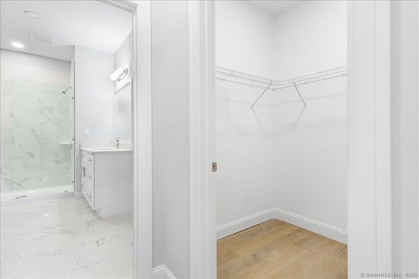 Bathroom, Interior, Marble, Marble Walls, Recessed Lighting, Walk-in Closets, Wood Texture Flooring