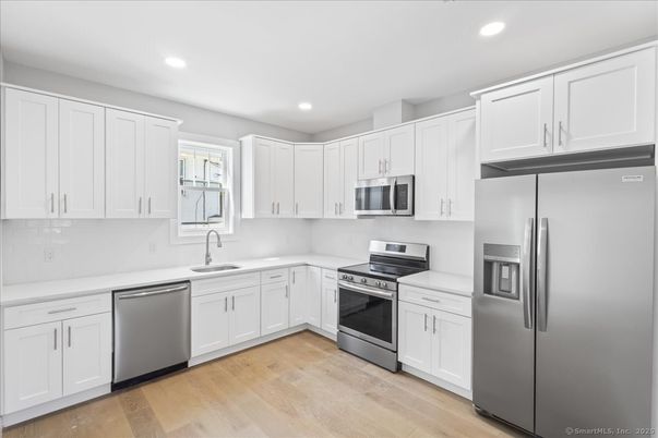 Interior, Kitchen, Recessed Lighting, Stainless Steel Appliances, Wood Texture Flooring