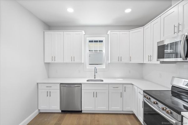 Interior, Kitchen, Recessed Lighting, Stainless Steel Appliances, Wood Texture Flooring