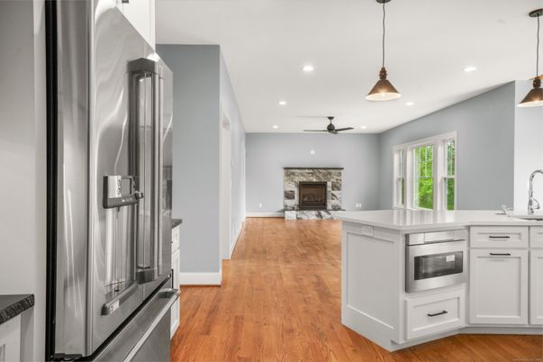 Fireplace, Interior, Kitchen, Pendant Lights, Recessed Lighting, Stainless Steel Appliances, Wood Texture Flooring