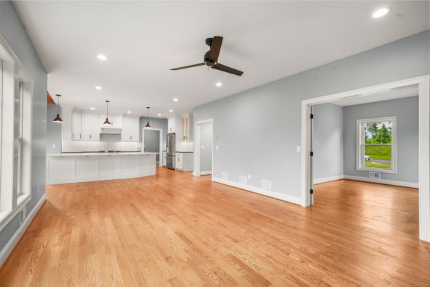 Empty room, Interior, Kitchen, Pendant Lights, Recessed Lighting, Stainless Steel Appliances, Wood Texture Flooring