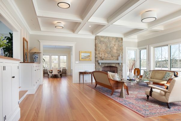 Dining room, Fireplace, Interior, Living room, Recessed Lighting, Stone Walls, Wood Texture Flooring