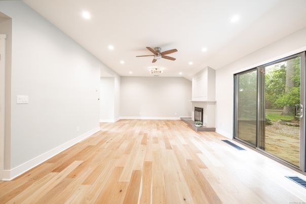 Empty room, Fireplace, Interior, Recessed Lighting, Wood Texture Flooring