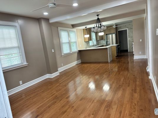 Empty room, Interior, Kitchen, Pendant Lights, Recessed Lighting, Stainless Steel Appliances, Stone Walls, Wood Texture Flooring