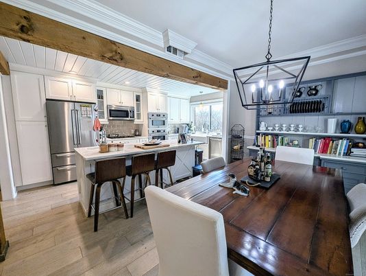 Chandelier, Dining room, Interior, Kitchen, Pendant Lights, Stainless Steel Appliances, Wood Texture Flooring