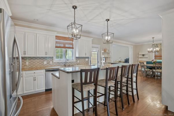 Chandelier, Dining room, Interior, Kitchen, Pendant Lights, Stainless Steel Appliances, Wood Texture Flooring