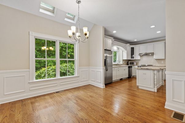 Chandelier, Interior, Kitchen, Pendant Lights, Recessed Lighting, Stainless Steel Appliances, Wood Texture Flooring