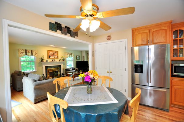 Dining room, Fireplace, Interior, Kitchen, Living room, Recessed Lighting, Stainless Steel Appliances, Wood Texture Flooring