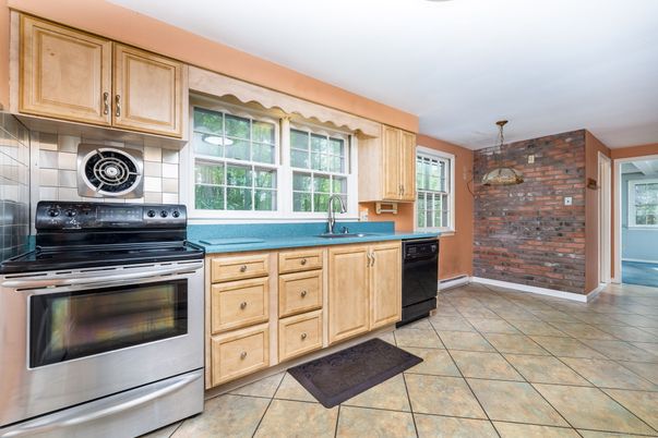 Interior, Kitchen, Pendant Lights, Stainless Steel Appliances, Stone Walls