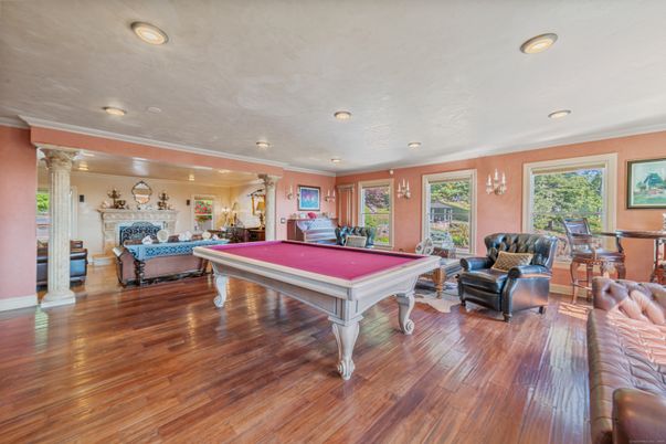 Billiard Table, Fireplace, Game Room, Interior, Living room, Recessed Lighting, Wood Texture Flooring