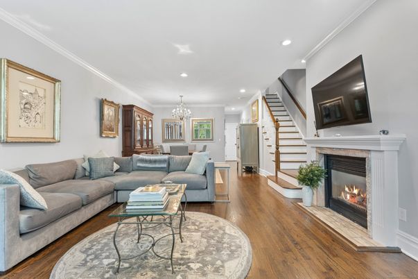 Chandelier, Dining room, Fireplace, Interior, Living room, Recessed Lighting, Wood Texture Flooring