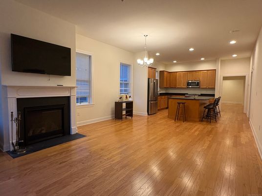Chandelier, Fireplace, Interior, Kitchen, Recessed Lighting, Wood Texture Flooring