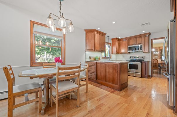 Dining room, Interior, Kitchen, Pendant Lights, Recessed Lighting, Stainless Steel Appliances, Wood Texture Flooring