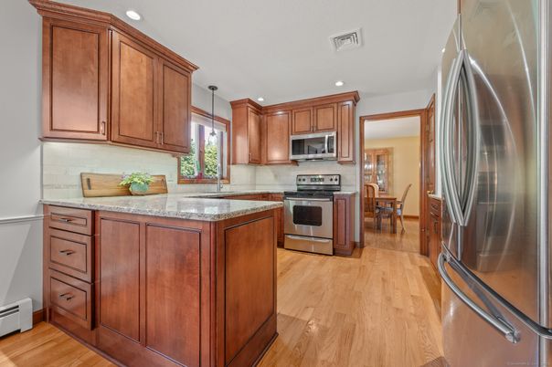 Dining room, Interior, Kitchen, Pendant Lights, Recessed Lighting, Stainless Steel Appliances, Wood Texture Flooring
