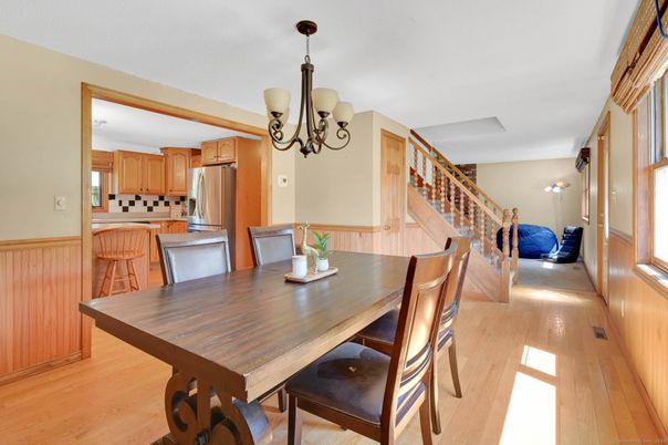 Chandelier, Dining room, Interior, Kitchen, Stainless Steel Appliances, Wood Texture Flooring