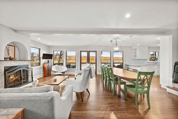Chandelier, Dining room, Fireplace, Interior, Living room, Pendant Lights, Recessed Lighting, Wood Texture Flooring