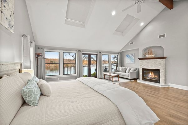 Bedroom, Fireplace, Interior, Recessed Lighting, Water, Wooden Beams, Wood Texture Flooring