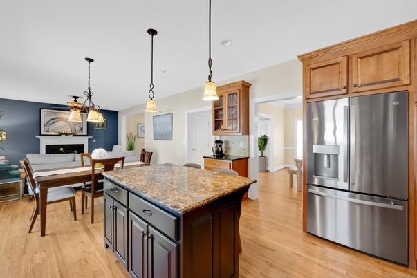 Dining room, Fireplace, Interior, Kitchen, Pendant Lights, Recessed Lighting, Stainless Steel Appliances, Wood Texture Flooring