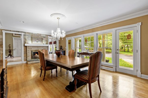Chandelier, Dining room, Fireplace, Interior, Recessed Lighting, Stone Walls, Wood Texture Flooring