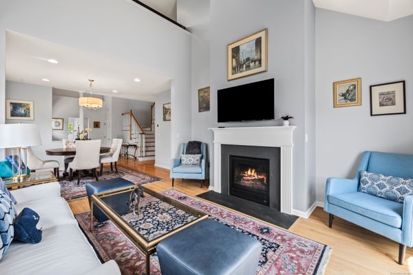 Chandelier, Dining room, Fireplace, Interior, Living room, Recessed Lighting, Wood Texture Flooring