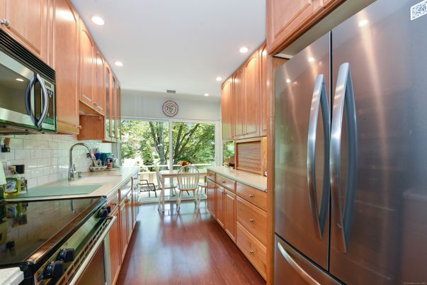 Dining room, Interior, Kitchen, Recessed Lighting, Stainless Steel Appliances, Wood Texture Flooring