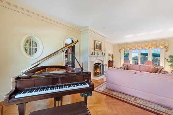 Fireplace, Interior, Living room, Piano, Recessed Lighting, Wood Texture Flooring