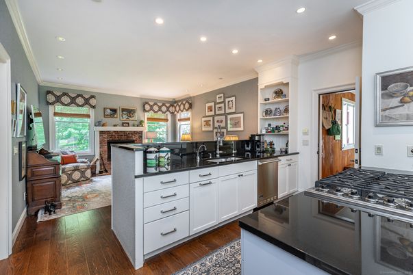 Fireplace, Interior, Kitchen, Living room, Recessed Lighting, Wood Texture Flooring