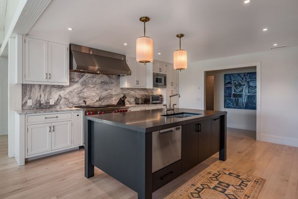 Interior, Kitchen, Marble Walls, Pendant Lights, Recessed Lighting, Stainless Steel Appliances, Wood Texture Flooring
