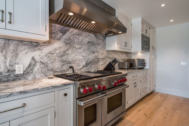 Interior, Kitchen, Marble Walls, Recessed Lighting, Stainless Steel Appliances, Wood Texture Flooring