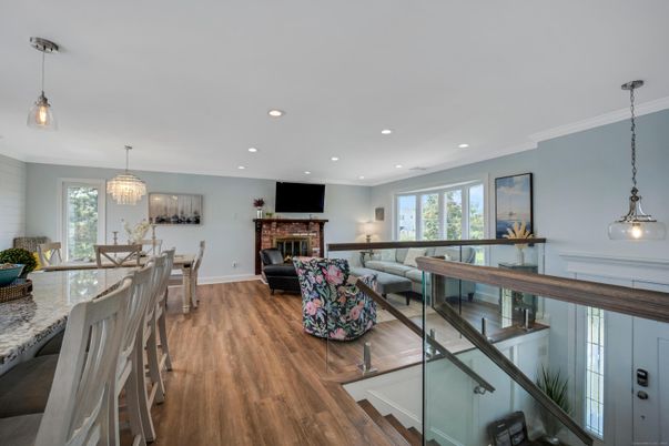 Chandelier, Dining room, Fireplace, Interior, Living room, Pendant Lights, Recessed Lighting, Wood Texture Flooring