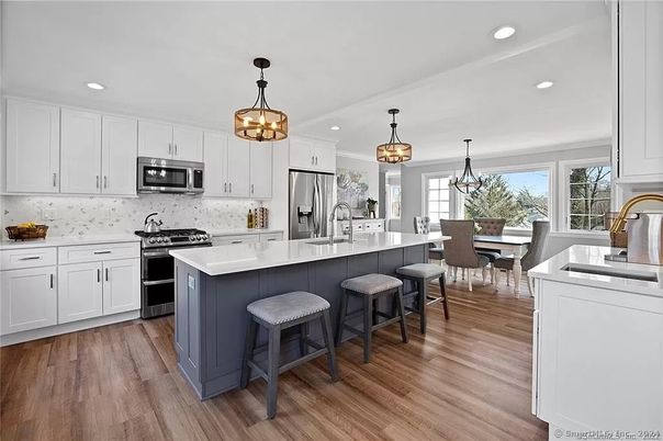 Chandelier, Dining room, Interior, Kitchen, Pendant Lights, Recessed Lighting, Stainless Steel Appliances, Wood Texture Flooring