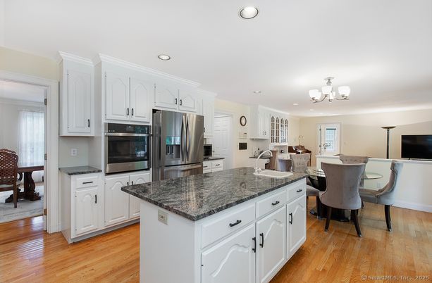 Chandelier, Dining room, Interior, Kitchen, Recessed Lighting, Stainless Steel Appliances, Wood Texture Flooring