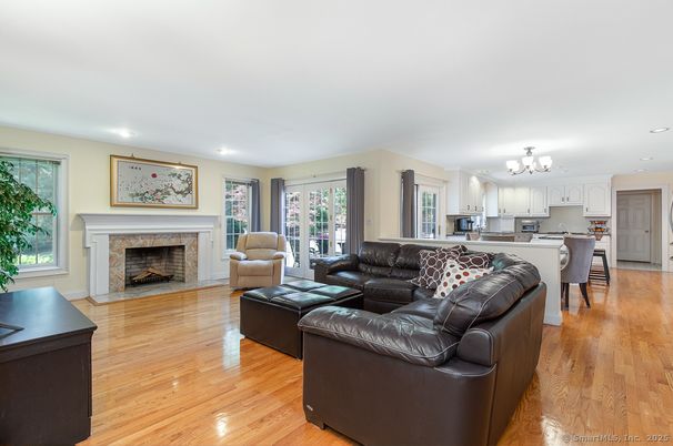 Chandelier, Fireplace, Interior, Kitchen, Living room, Recessed Lighting, Wood Texture Flooring