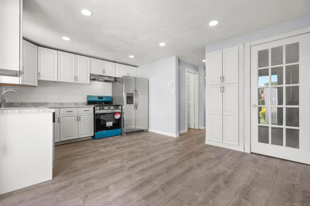 Interior, Kitchen, Recessed Lighting, Stainless Steel Appliances, Wood Texture Flooring