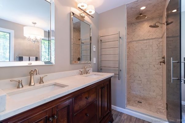 Bathroom, Chandelier, Dual Sink Vanities, Glass Shower, Interior, Recessed Lighting, Wood Texture Flooring