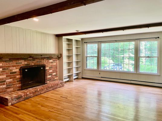 Empty room, Fireplace, Interior, Recessed Lighting, Stone Walls, Wooden Beams, Wood Texture Flooring