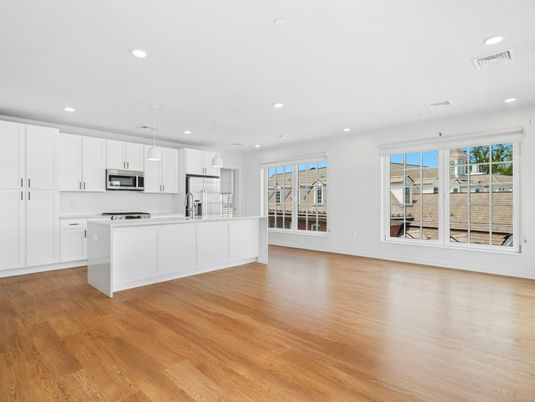 Empty room, Interior, Kitchen, Pendant Lights, Recessed Lighting, Stainless Steel Appliances, Wood Texture Flooring