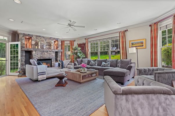 Fireplace, Interior, Living room, Recessed Lighting, Stone Walls, Wood Texture Flooring
