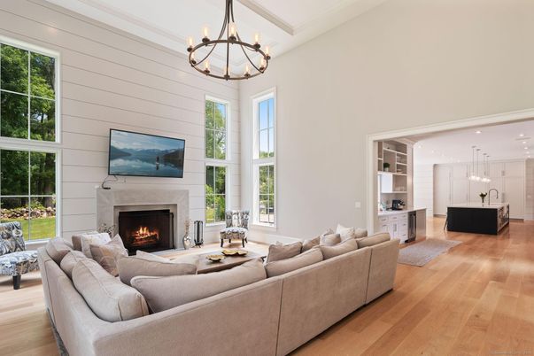 Chandelier, Fireplace, Interior, Living room, Pendant Lights, Recessed Lighting, Wood Texture Flooring