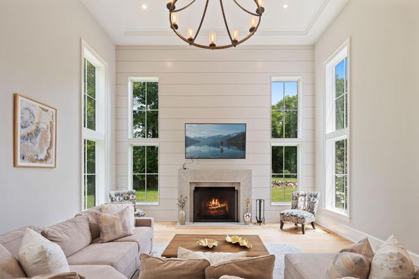 Chandelier, Fireplace, Interior, Living room, Pendant Lights, Recessed Lighting, Wood Texture Flooring