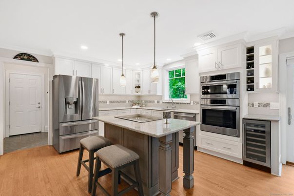 Interior, Kitchen, Pendant Lights, Recessed Lighting, Stainless Steel Appliances, Wood Texture Flooring