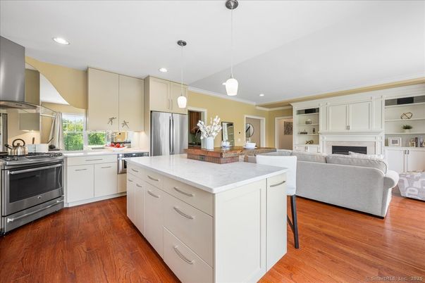 Fireplace, Interior, Kitchen, Pendant Lights, Recessed Lighting, Stainless Steel Appliances, Wood Texture Flooring