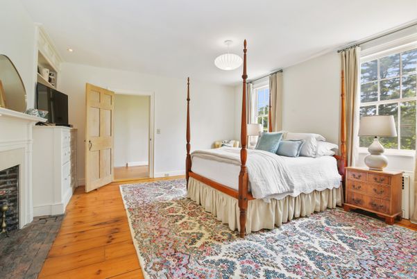 Bedroom, Chandelier, Fireplace, Interior, Recessed Lighting, Wood Texture Flooring