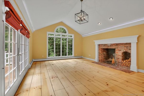 Empty room, Fireplace, Interior, Pendant Lights, Recessed Lighting, Stone Walls, Wood Texture Flooring