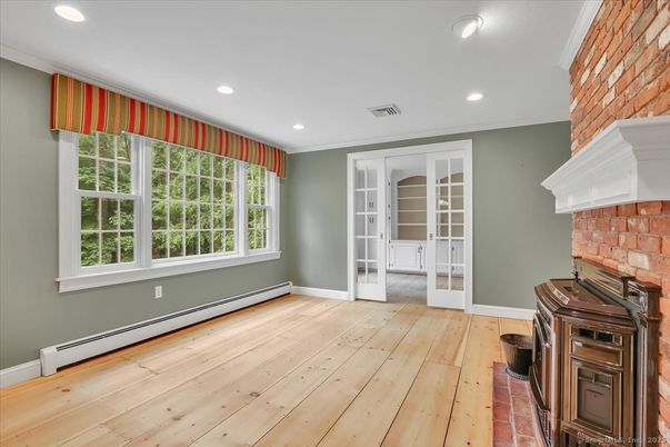 Empty room, Fireplace, Interior, Recessed Lighting, Stone Walls, Wood Texture Flooring