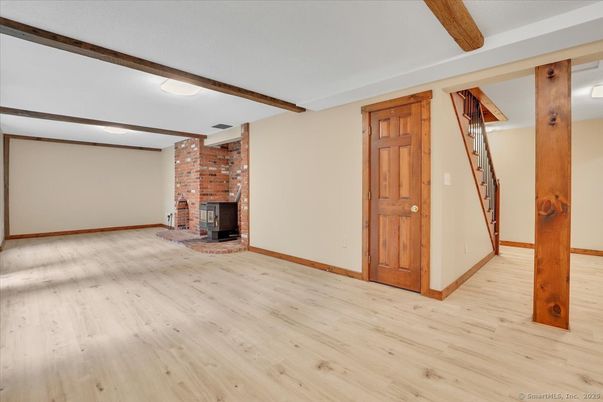 Empty room, Fireplace, Interior, Stone Walls, Wooden Beams, Wood Texture Flooring