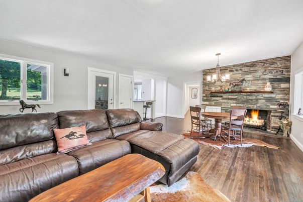 Dining room, Fireplace, Interior, Living room, Pendant Lights, Stone Walls, Wood Texture Flooring