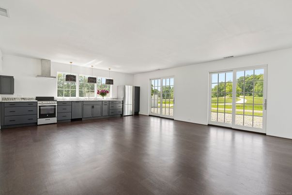 Empty room, Interior, Kitchen, Pendant Lights, Stainless Steel Appliances, Wood Texture Flooring